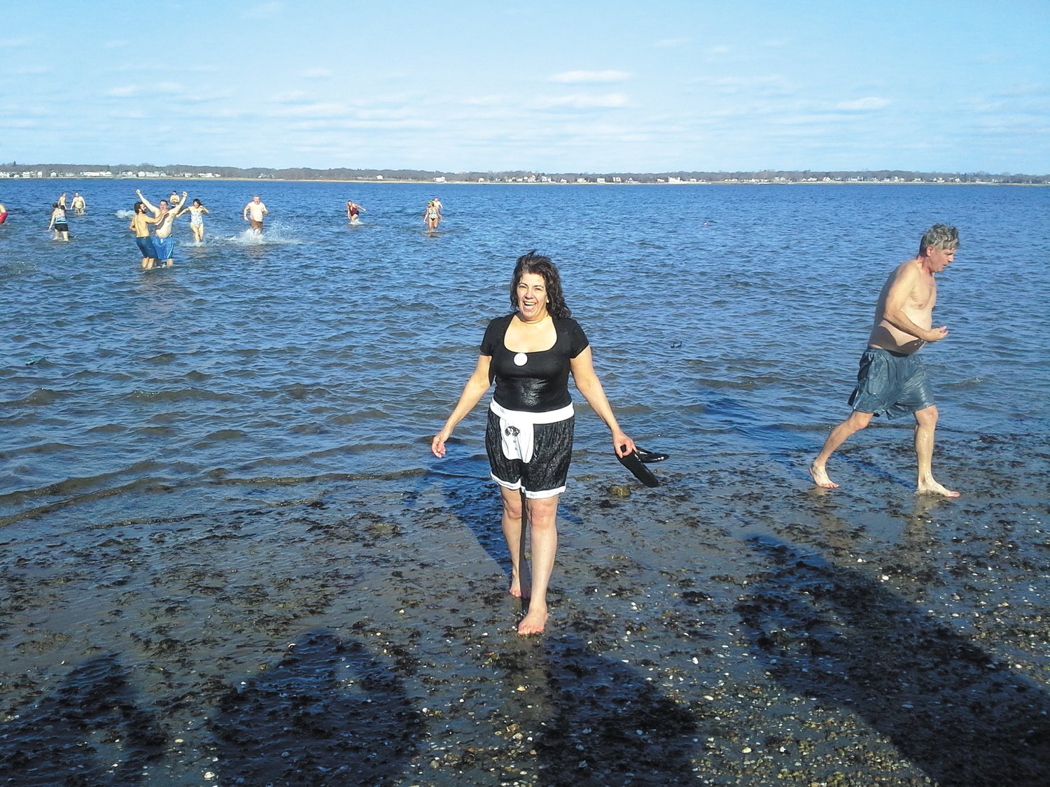 ALL FOR THE CAUSE: Program coordinator at Mentor RI, Pam Sherman, following a dip in Greenwich Bay during the annual Frozen Clam Dip. Pam, who worked for the agency for 23 years died this fall. (Submitted photo)